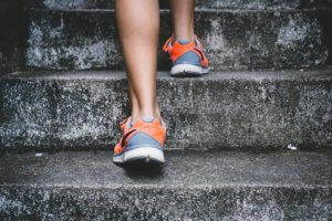 Close Up of Feet in Trainers going up Steps