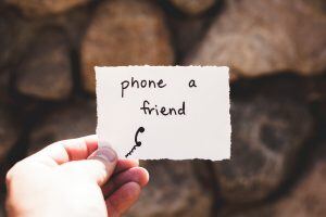 piece of paper with phone a friend written on it