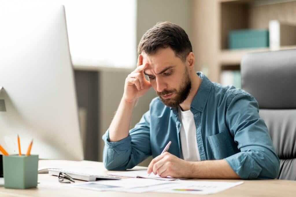 Image of someone struggling with loneliness because of hybrid and remote working.